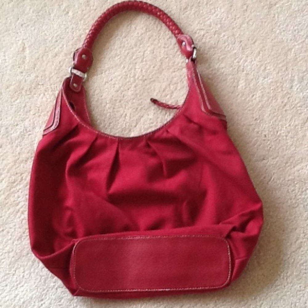 Red hobo bag with comfy braided handle.